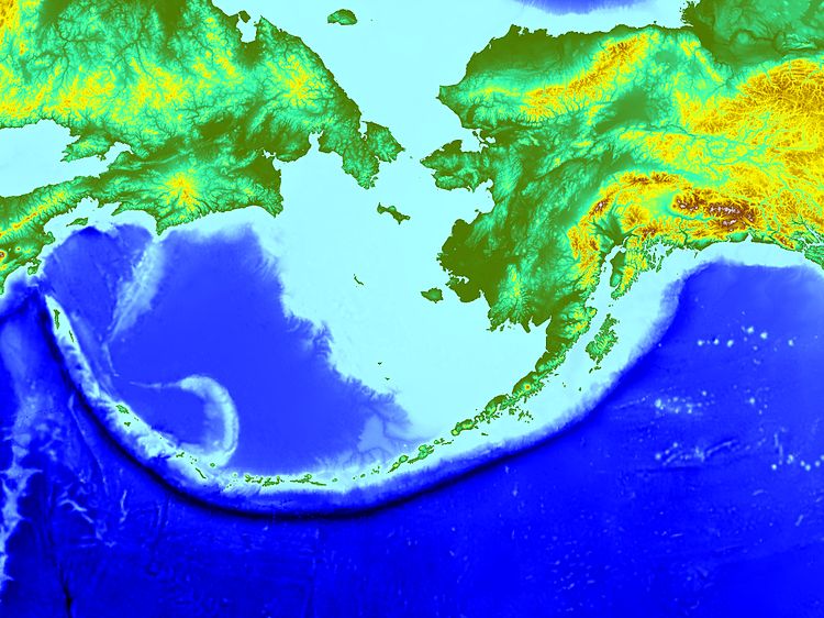 The Pacific Plate descends into the mantle at the site of the Aleutian Trench. Subduction zone volcanism here has generated the Aleutian island chain of active volcanoes. Courtesy of NOAA.